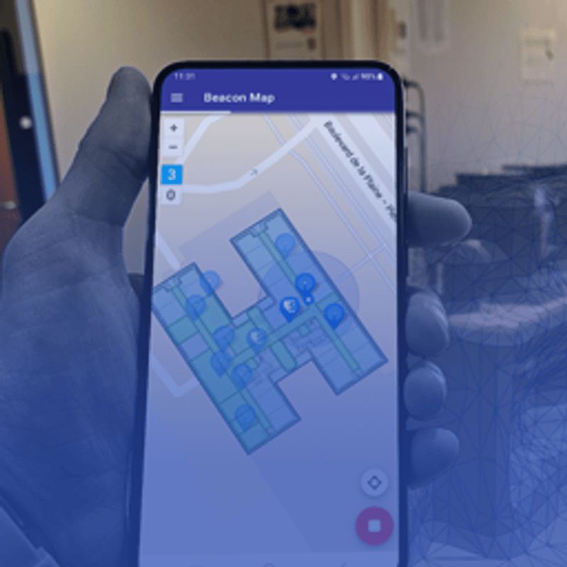 Smartphone showing an indoor beacon map of a building floor